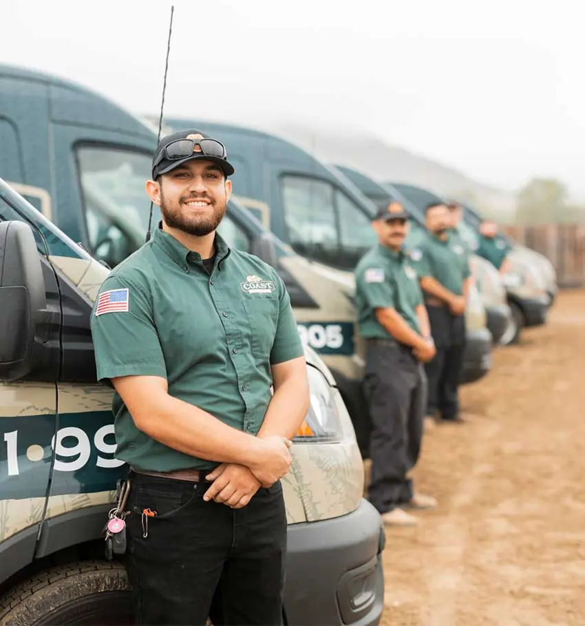 Coast Plumbing technician with a customer