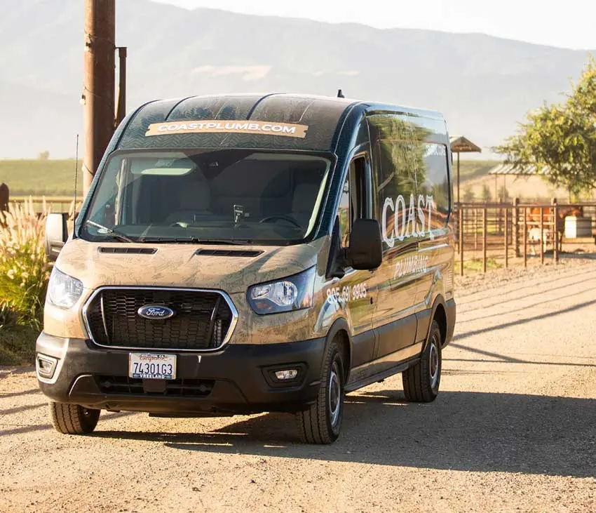 Coast Plumbing service van on a ranch road in the Santa Ynez Valley
